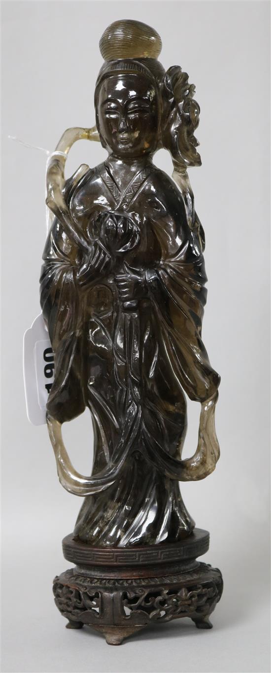 A late 19th / early 20th century Chinese smoky quartz figure of a lady, wood stand